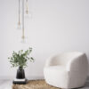 Cozy living room interior, white modern armchair on white backgr Pakabinamas šviestuvas Nilos Black Gold 1